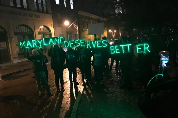 AFSCME members hold up a Maryland Deserves Better sign